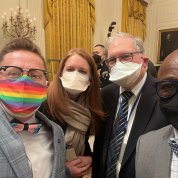 group shot of four individuals in face masks
