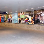 view of one wall in the underpass with photos of various NIH scenes