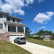 House with several similar homes seen in the background