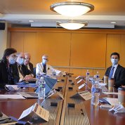 Several people seated around a conference table
