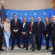 Jha stands with several other individuals who work at NIH and/or VRC