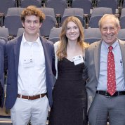 Large group of people smile into camera