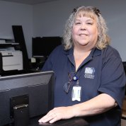 Hicks stands in the center