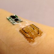 Smart bandage attached to sensors on a person's forearm