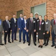 Group photo of Ukraine delegation and NIH hosts, standing on a CC terrace