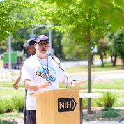 Tosten speaks at a podium