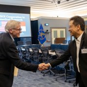 Dr. Cliff Lane shakes hands with Sadikin.