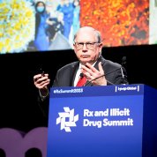 Dr. Lawrence Tabak at summit podium