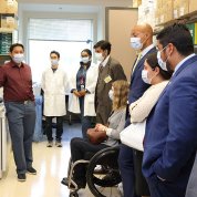 Fellows in lab listen to Dr. Chien.