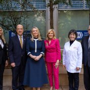 Haydon and Biden pose with NIH leadership outside the Clinical Center.