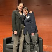 Murray has arm around Bertagnolli as they smile together on stage.