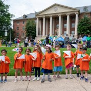 Another group of preschool kids in orange shirts