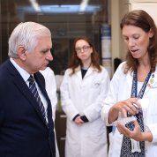 Heske shows Reed a well plate