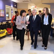 Bertagnolli talks with Reed while walking through a clinic