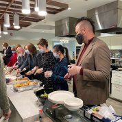 Servers dish out food.