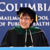 Bertagnolli in graduation regalia at the podium