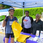 A bicyclist collects swag from the NIH Federal Credit Union