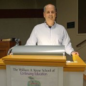 Lorsch stands at a podium