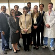 Bertagnolli stands in center of group.