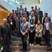 A group of HIRN attendees arranged on a set of stairs.