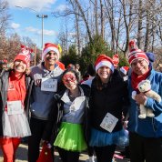 Relay runners pose for a group photo