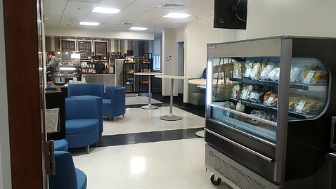 View of the Bldg. 1 cafe, with its full-service counter and comfy blue chairs.
