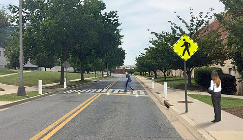 artist's simulation of campus road with newly painted and newly lit crosswalk