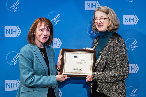 NINR director Dr. Grady presents plaque to Dr. Heitkemper