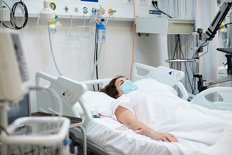 Patient lays down on a hospital bed