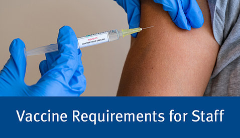 A blue glove-covered hand injects a Covid vaccine needle into an arm, with the text below: Vaccine Requirements for Staff