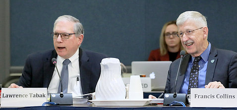 Tabak and Collins smile, seated at the ACD meeting table