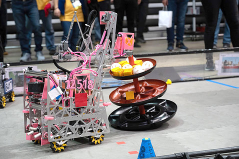 Gadget with wheels, levers, and pulleys in pink