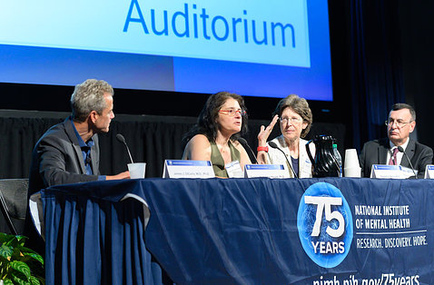 Speakers participate in a panel discussion. 