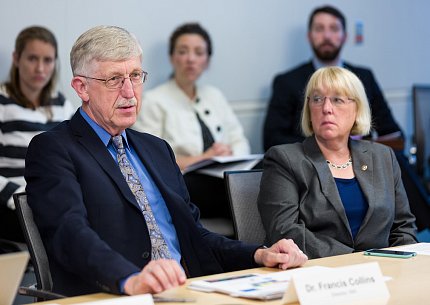 Collins and Sen. Patty Murray sit at a board table