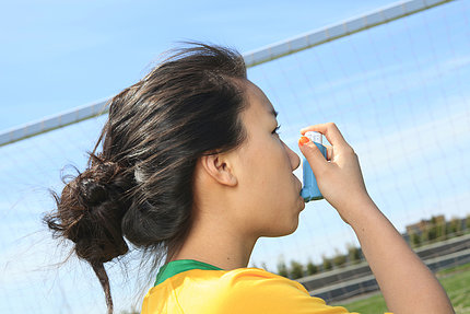 Girl using inhaler
