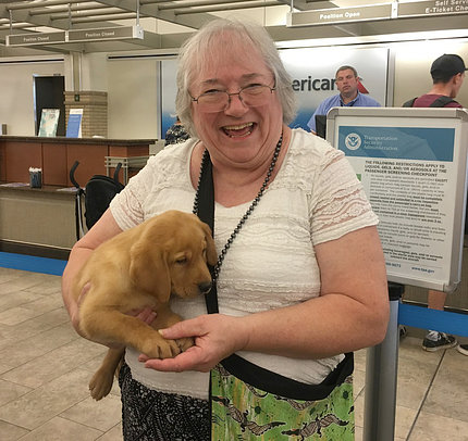 Dr. Bonnie Mathieson holding a puppy.