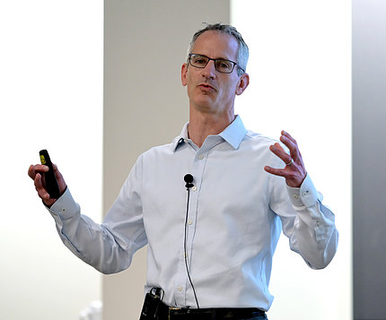 Philpot gestures with his hands during NIH lecture.