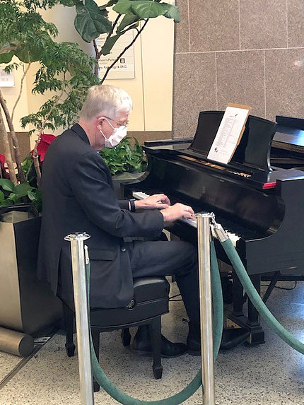 Dr. Collins plays piano.