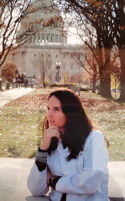 Kathleen Tepas sits outside in front of the Capitol