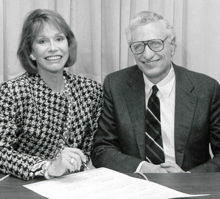 Actress Mary Tyler Moore and Phillip Gorden seated, smiling