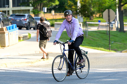 FIC deputy director Dr. Peter Kilmarx pedals to work. 