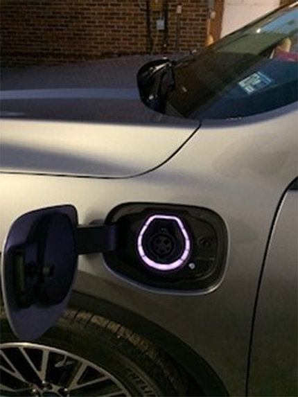 A closeup look at the electric plug on an electric car
