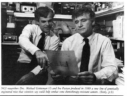 grainy black&white scanned image of Gottesman and Pastan holding a research image.