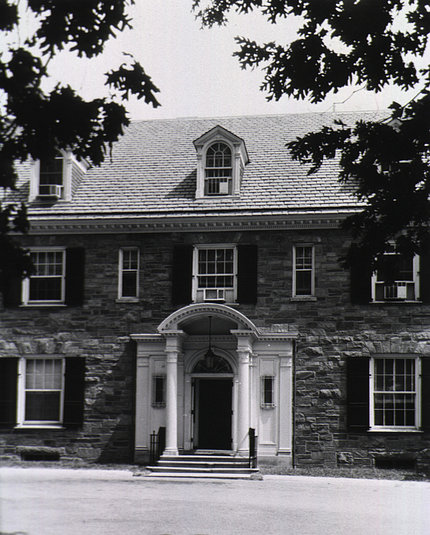 A black and white photo of the Stone House