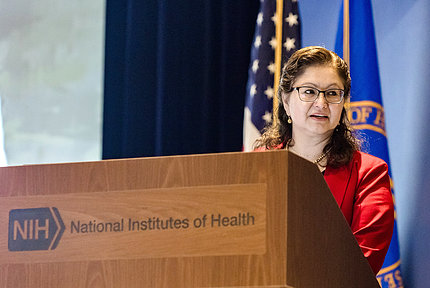 Farias at NIH podium