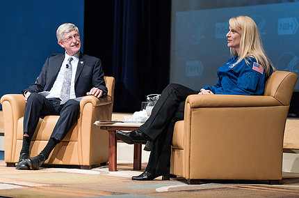 Rubins and Collins chat, seated on stage in Masur Auditorium.