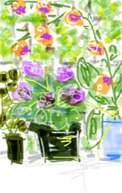 Two green and one clear vase on a table filled with purple and yellow flowers