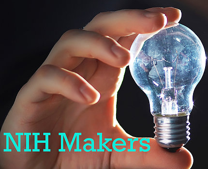 Hand holding a light bulb with teal "NIH Makers" text below