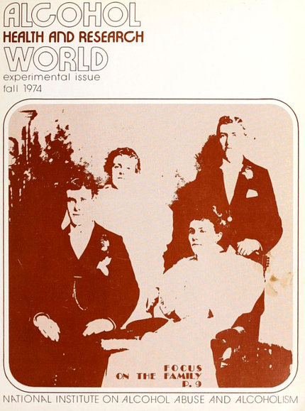The cover of the first publication in 1974. An image on the front shows a faded black and white photo of a family.