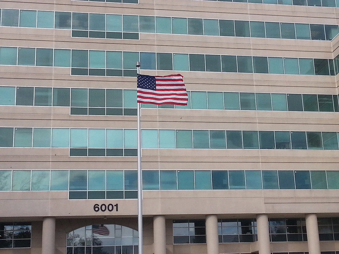 A new flag flies over the Neuroscience Center Bldg.
